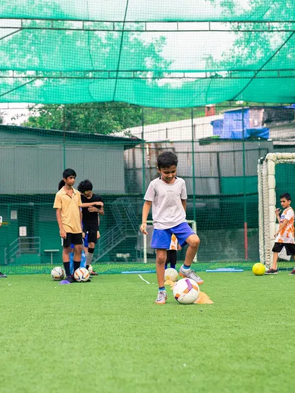 A wide shot of our junior football training, where kids learn fundamental skills in a fun and supportive group environment.