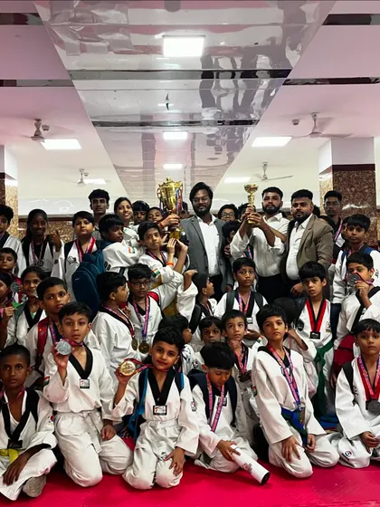The result of hard work and dedication. My team of young champions from the Warrior Fight Club celebrating their wins with medals and trophies after a tough tournament.