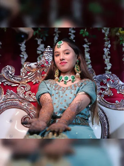 The bride showing off her full bridal mehendi. She looks absolutely radiant.