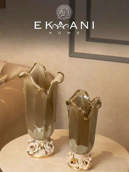 The smoky grey hue of these Murano glass vases adds a sophisticated and modern touch. Placed on a console table, they create an elegant display of sculptural beauty.