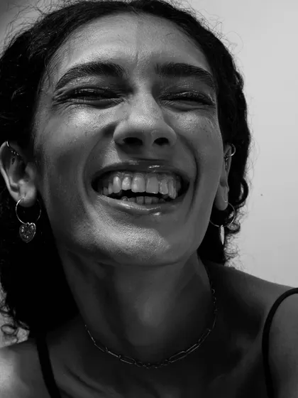 The beauty of capturing a series of expressions. This shot, with eyes closed in laughter, feels completely free and authentic.