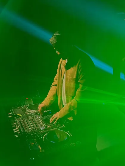 A moody shot of me mixing under green lights.