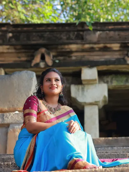A classic maroon blouse with delicate gold embroidery, a versatile piece that pairs beautifully with many silk sarees for a traditional yet elegant look.