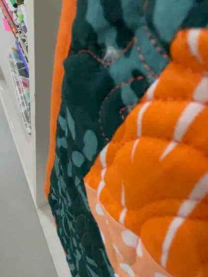 A close-up of the 3D quilt's binding, showing the thickness and quality of the finished piece.