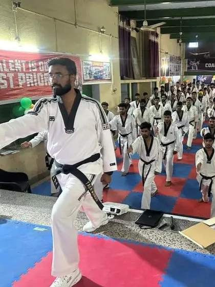 Another shot of me instructing at the referee seminar, demonstrating proper stances and movements.