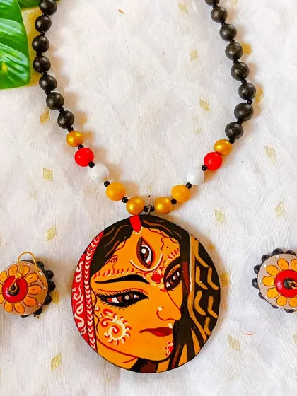A duplicate image of the full-face Durga pendant, a key item for festive bulk orders.