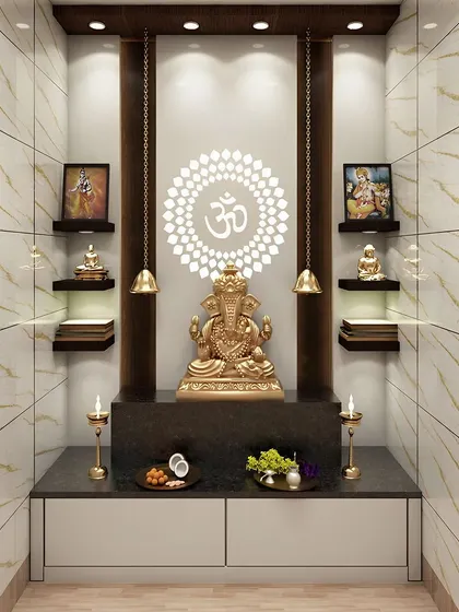 A luxurious pooja room with floor-to-ceiling marble tiles. The design features a golden Ganesha, a backlit Om, and hanging bells, creating a truly divine space.