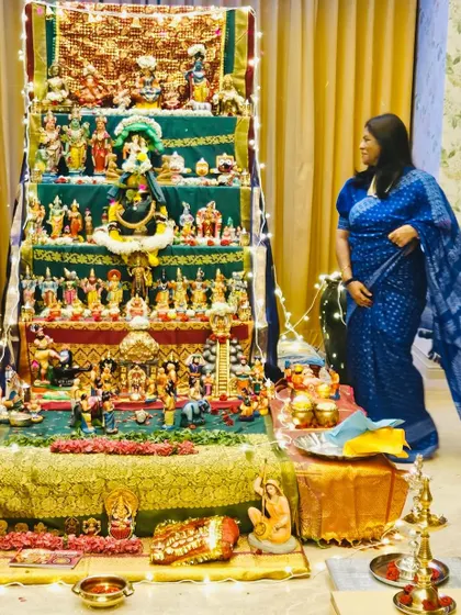 Admiring the beautiful arrangement of Dasara dolls. Each doll symbolizes wisdom, strength, and prosperity, reflecting the grace of Navratri.