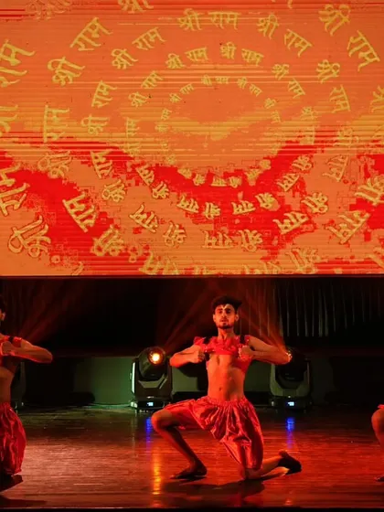 Three of our male dancers in a strong, grounded stance, portraying the power and intensity of the performance.