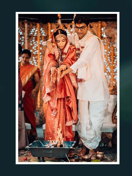 A sacred moment as the couple participates in the 'saat phere' ritual around the holy fire.