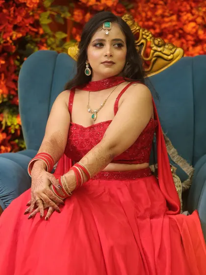 A seated portrait, looking regal and beautiful against a colorful backdrop.