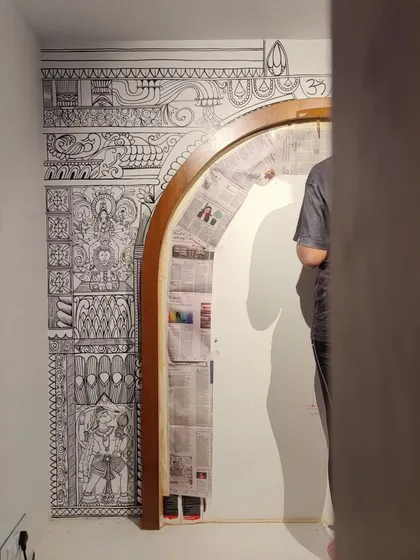 A view of the puja room mural in progress. The wooden arch is protected while I carefully work on the surrounding wall.