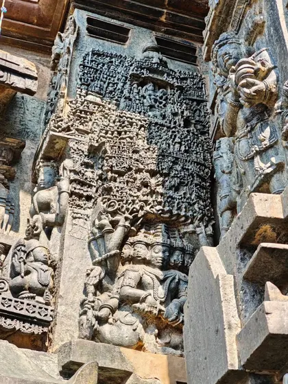 An incredibly detailed carving on the temple walls in Halebidu, showcasing the skill of the ancient sculptors.