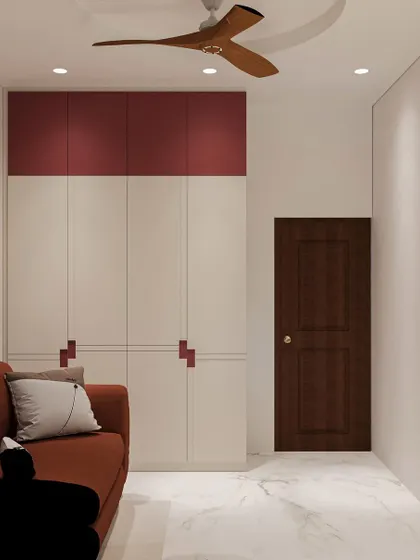 A custom wardrobe with unique red handles provides ample storage, ensuring the home office remains organized and clutter-free.