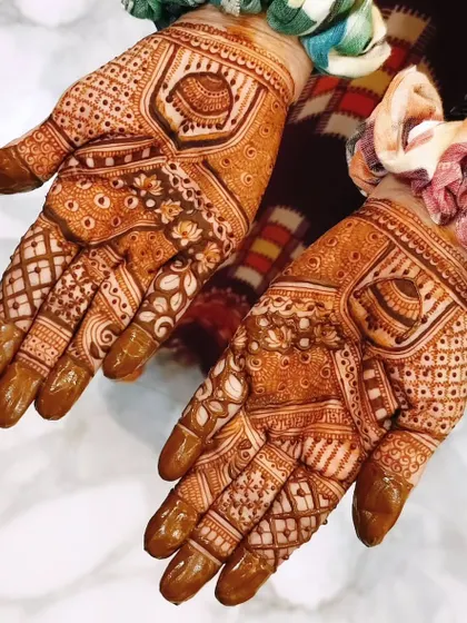 This design showcases a beautiful, mature henna stain. The patterns are a mix of floral and geometric, and the deep color is the result of my organic henna paste.