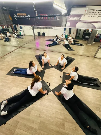The whole group moving in sync during a Bhujangasana or Cobra Pose circle. This pose is fantastic for strengthening the spine and opening up the chest.