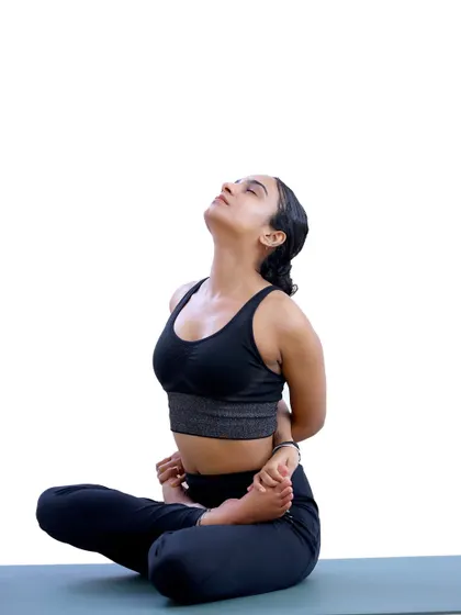 A deep bind in Baddha Padmasana (Bound Lotus Pose). You decide if it's 'one day' or 'day one'.