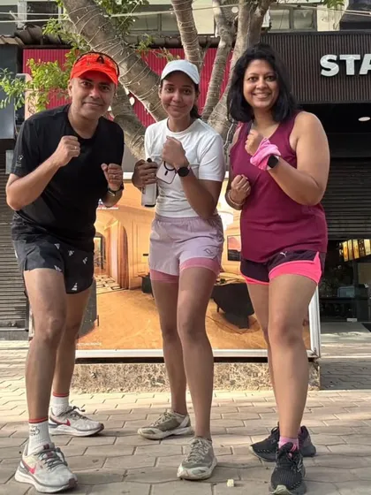 Post-run smiles outside our favorite coffee spot. The reward after the hard work is sharing the moment with your tribe.