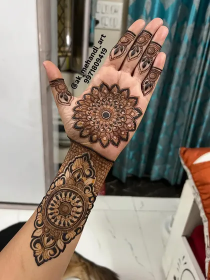 A close-up of the intricate mandala and cuff design. The detailed shading and dot work create a stunning 3D effect.