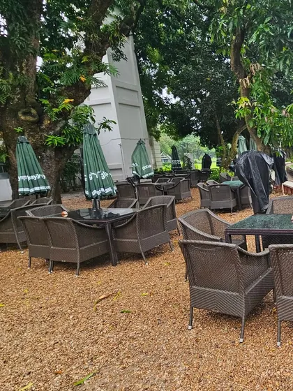 Our outdoor furniture at a top club in Kolkata, ready to face the elements. The use of furniture covers and durable materials ensures longevity even in open-air settings.