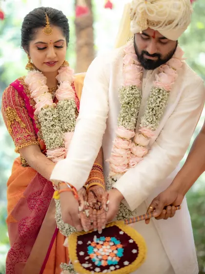 The Jeerige Bella ritual, a sweet tradition symbolizing the couple's union. I captured this moment from a distance, showing the couple surrounded by their loved ones.