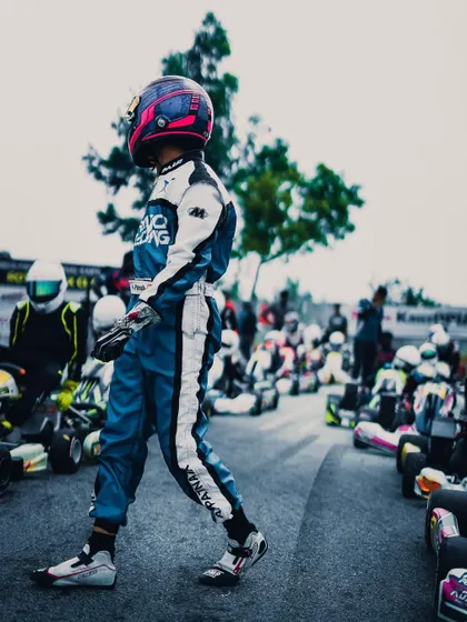 A stylish shot of one of our drivers walking through the pit lane, ready for the final round of the Rotax championship.