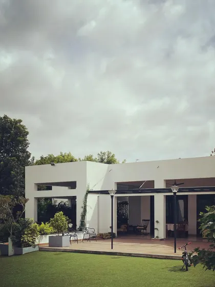 The "Verandah House" on a beautiful Sunday morning. The architecture is purposefully restrained, allowing the home to sit peacefully within its garden setting.