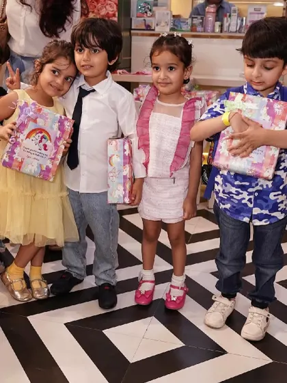 Kids showing off their unicorn-themed party favors.