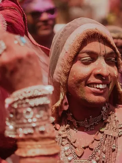 A vibrant collection of images from the Holi celebrations in Braj, specifically Nandgaon. This series captures the pure ecstasy of the festival, with portraits of devotees, men dressed as gopis, and crowds dancing in a cloud of colors.