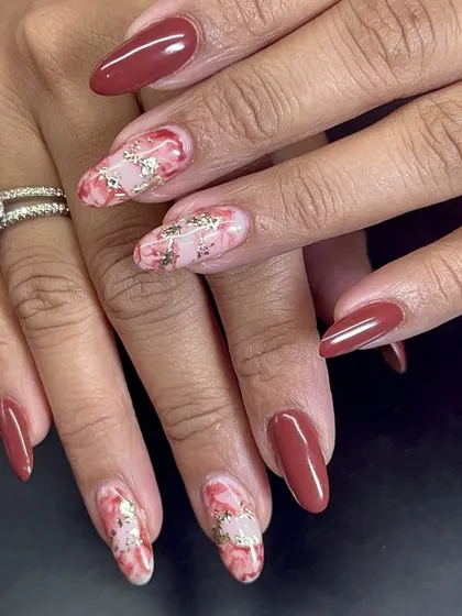 This marble-effect nail art with gold foil is a very popular and high-end look.