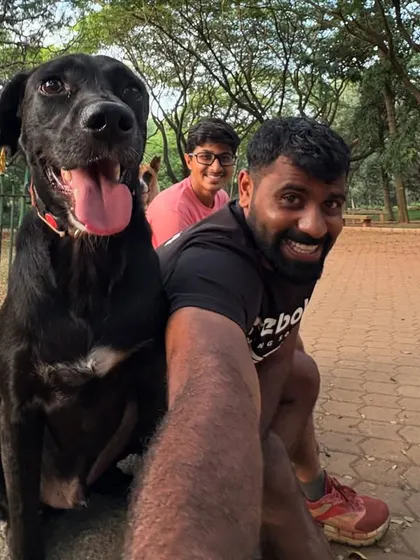 A selfie with Batman and a friend. This is my happy place.