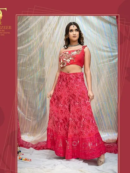 Another angle of the red sharara set, showcasing the beautiful flare of the pants and the intricate floral embroidery on the blouse.