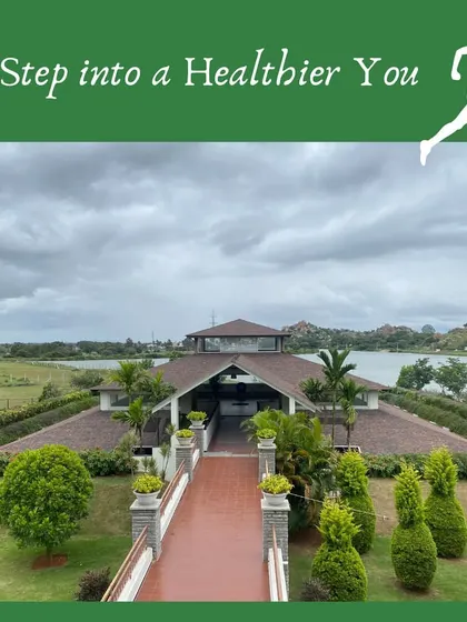 An inviting view of the main building across the lawn, framed to suggest the start of a healthier life. This image encapsulates our promise: a beautiful place to begin your transformation.