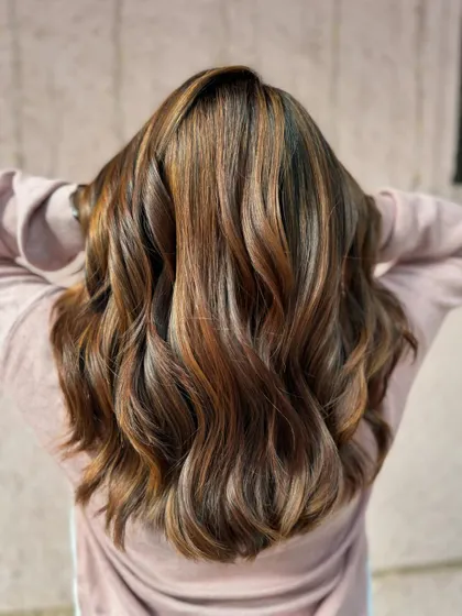The back view of this bridal hair shows off the beautiful blend of brown tones. It’s elegant, timeless, and photographs beautifully. (No filter)