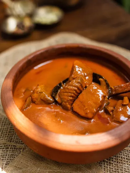 This is my Alleppey Fish Curry, made the traditional way in an earthen pot or 'chatti' to get that authentic, tangy flavor. It's a thick, spicy curry with generous chunks of fresh Seer fish, perfect for soaking up with appams or idiyappams.