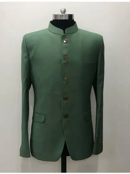 A simple yet elegant solid green Jodhpuri jacket on a mannequin. The clean cut and classic bandhgala collar make it a versatile piece.