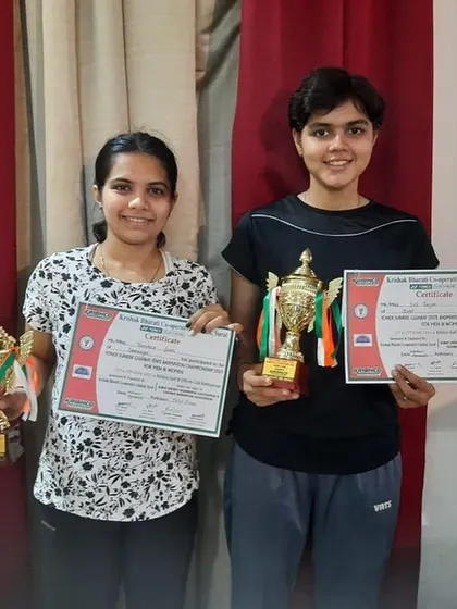 Tanisha Joshi and her partner celebrating their third-place finish in the Gujarat Senior State Ranking Tournament.