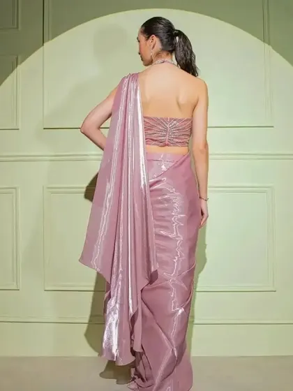The back view of the mauve metallic drape saree, showing the elegant halter-style blouse.