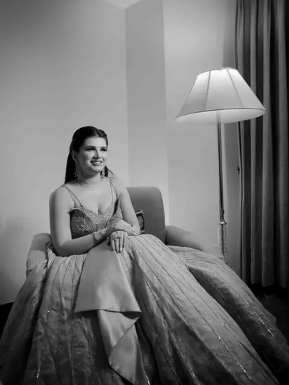 A slightly different angle of the bride's elegant engagement portrait. The black and white edit emphasizes her classic beauty and the details of her gown.