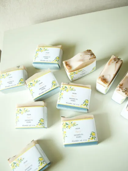 An assortment of the lavender and plain soaps, all wrapped in the beautiful lemon-themed labels for the bridal shower.