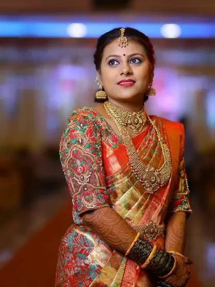 Another angle showcasing the intricate craftsmanship of this bridal blouse. The detailed zardosi and threadwork catch the light beautifully, adding to the festive look.
