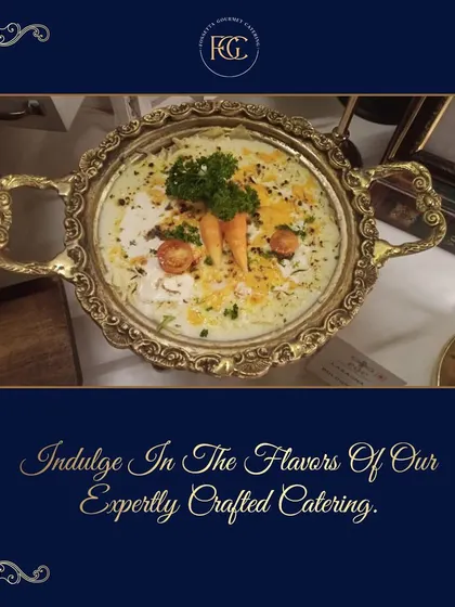 A close-up of a main course dish served in a decorative silver bowl. The rich, creamy texture and garnish of fresh vegetables highlight the quality and expert preparation of our food.