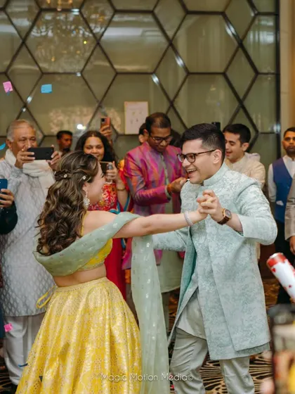 A candid dancing shot, showing how the hairstyle stays beautiful even while celebrating.