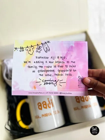A close-up of our custom watercolor announcement card. We can personalize the message to grandparents, including the expected arrival date, to make your pregnancy reveal extra special.