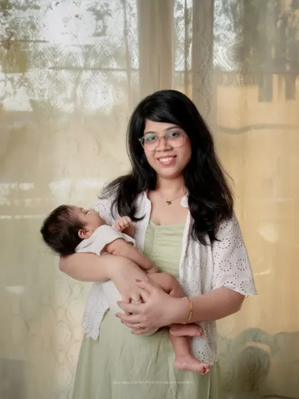 A mother's gentle smile says it all. I love capturing these bright, natural-light portraits that show the pure happiness of motherhood.