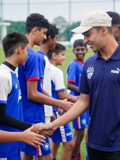 A BFC player greets the young athletes from Loyola School, Pune. These interactions are an invaluable part of our camp experience.