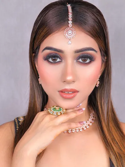 Behold this stunning glittery smokey eye, another masterpiece created by one of our talented students.