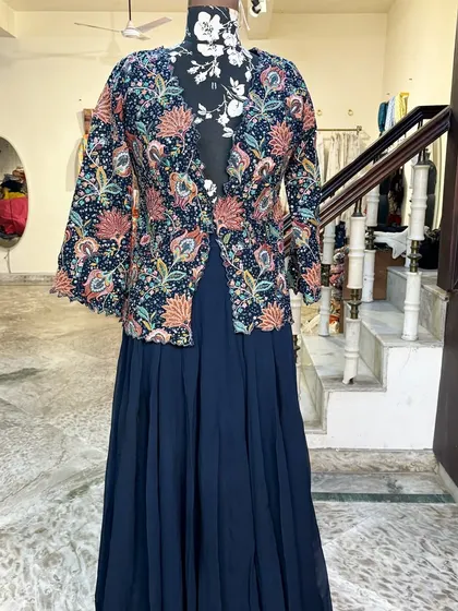 The full view of the jacket and skirt set. The flowy skirt is comfortable and stylish.