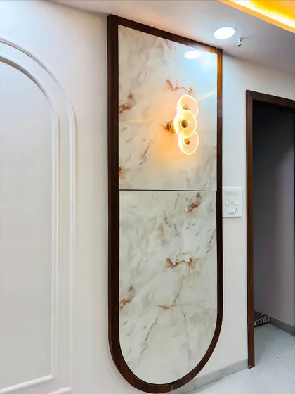 This decorative wall panel with a built-in accent light is designed to be a feature piece in a dining area, adding a touch of elegance and ambient lighting.