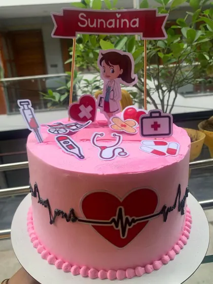 An interactive photo-pulling cake with a medical theme.